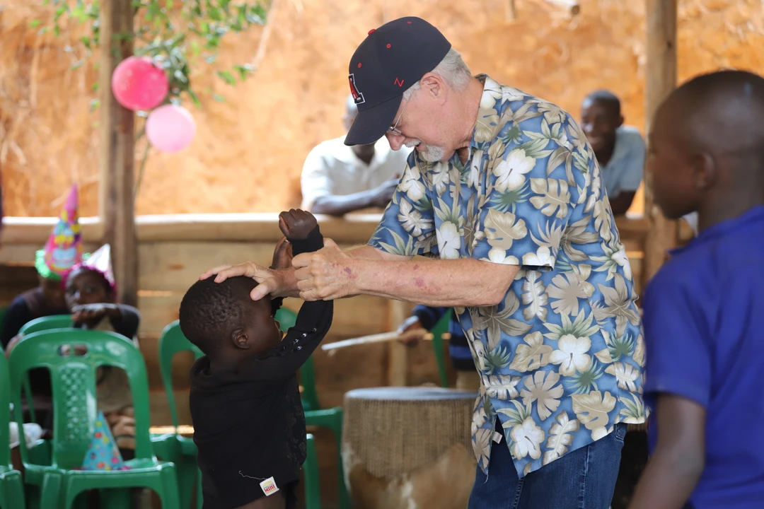 David Bryant praying for a child
